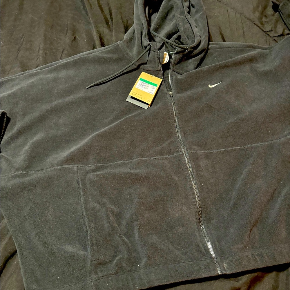 Nike new with tags black fleece cropped zip up jacket. Size XL womens. Stretchy